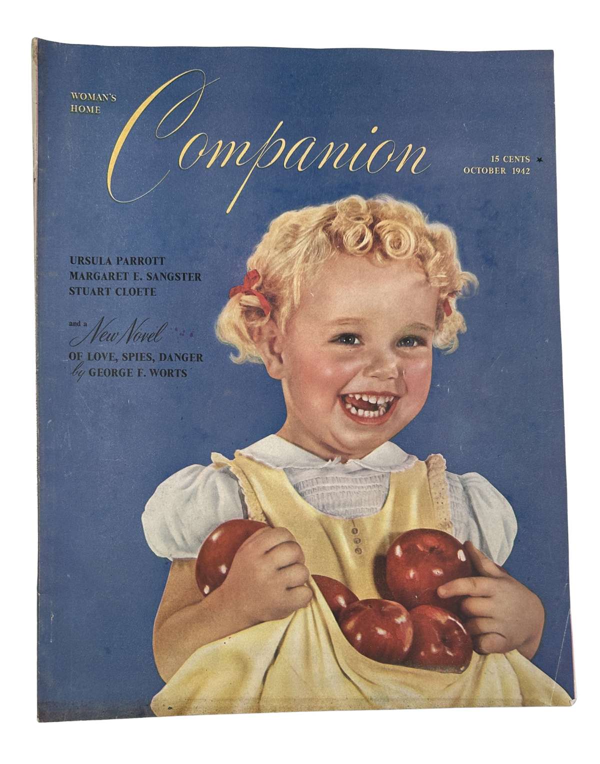 Cover of Woman's Home Companion Magazine, October 1942, featuring a smiling child holding apples, showcasing the title and illustration by Ruth Alexander Nichols.