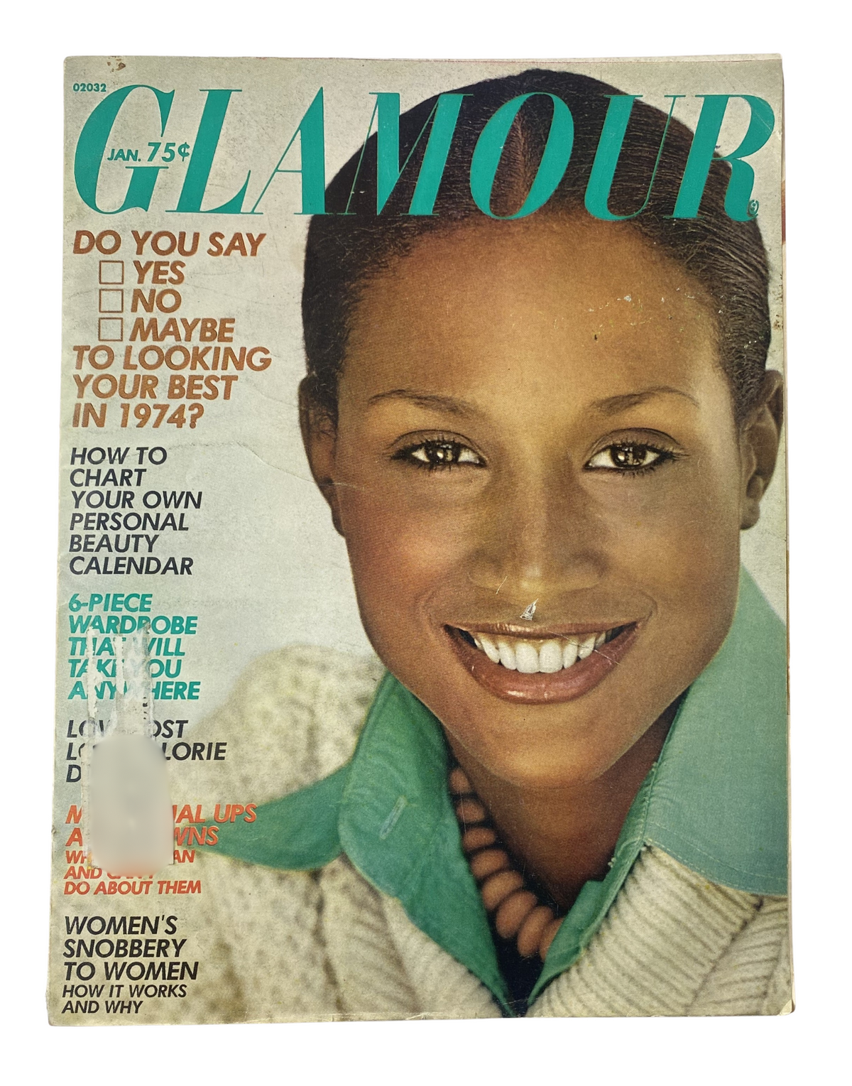 Glamour Magazine January 1974 cover featuring a smiling model with a stylish green sweater, emphasizing beauty and fashion insights from the era.
