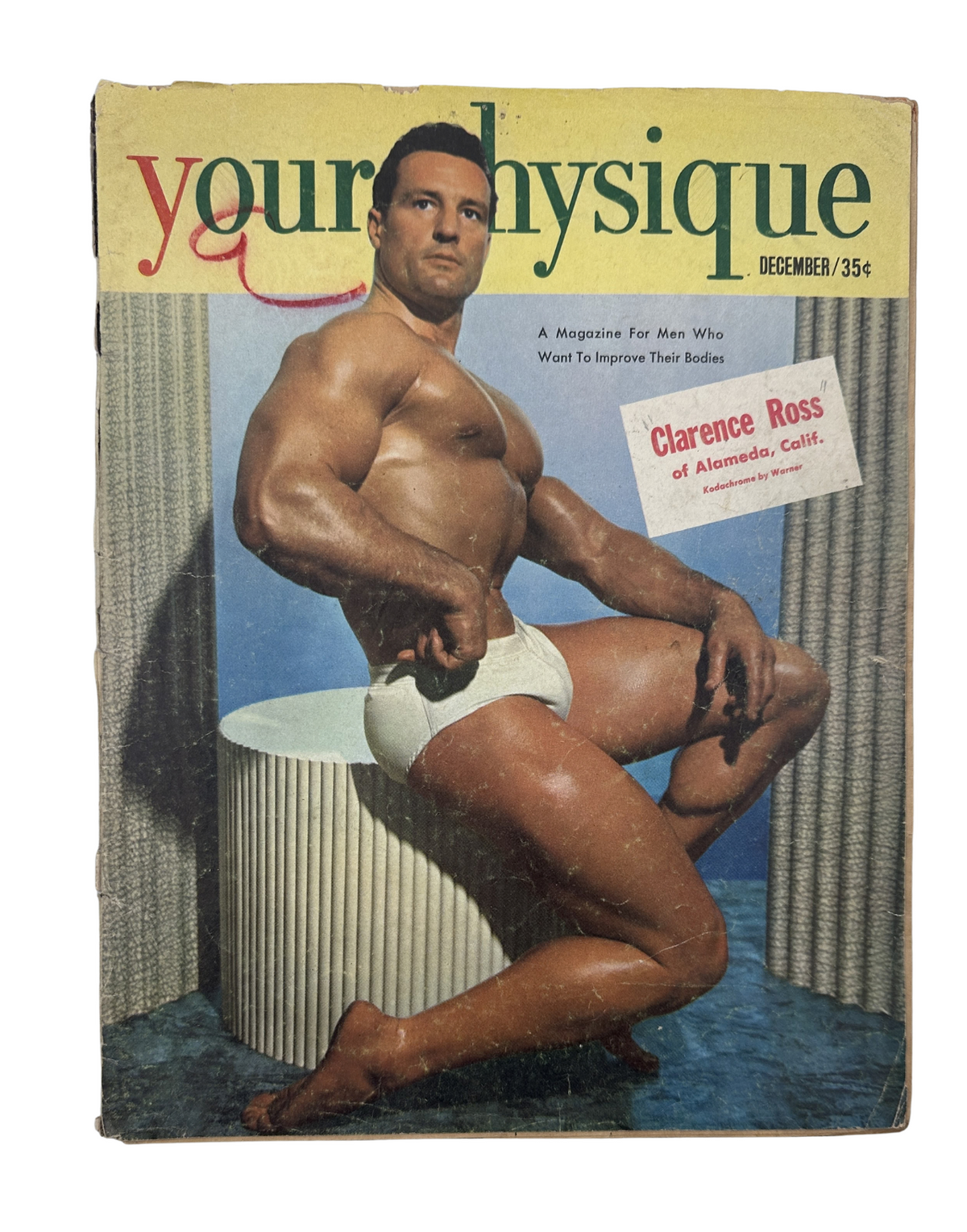 Your Physique Magazine December 1951 featuring Clarence Ross on the cover, showcasing a muscular bodybuilder against a colorful backdrop.