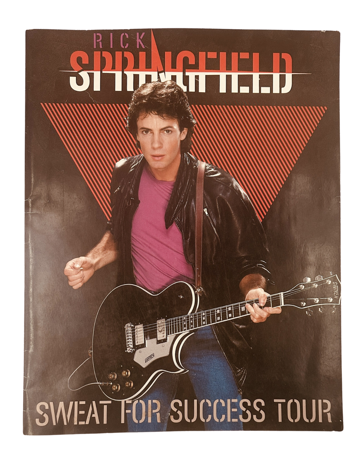 Rick Springfield Magazine 1982 Sweat For Success Tour cover featuring Rick Springfield posing with a guitar, embodying the vibrant energy of the early '80s rock scene.