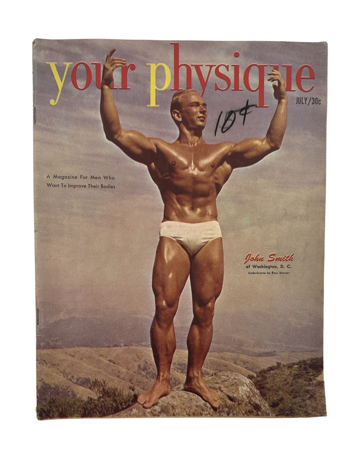 Your Physique Magazine July 1951 featuring John Smith on the cover, showcasing a muscular male bodybuilder in a natural setting, promoting fitness and bodybuilding.
