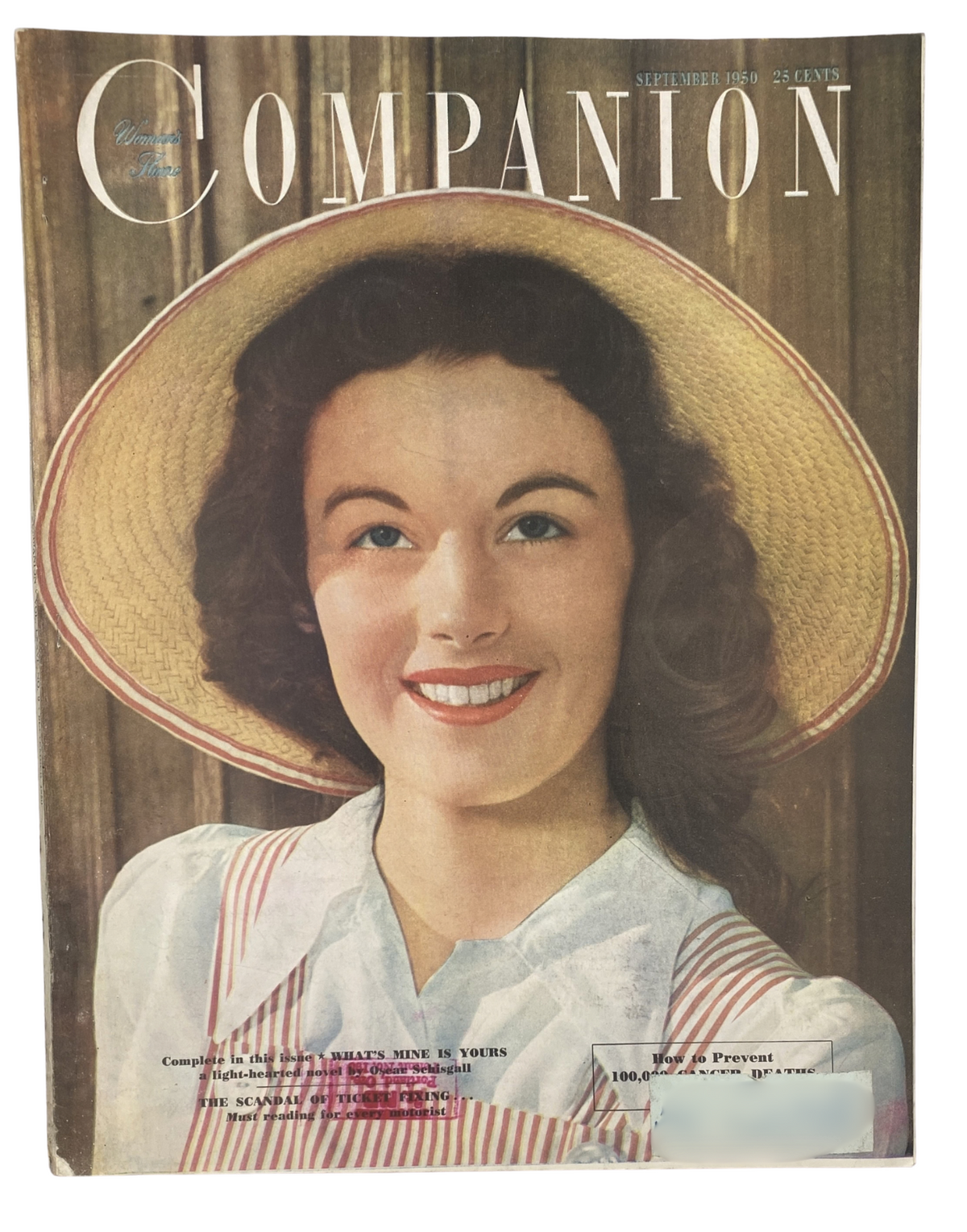 Cover of Woman's Home Companion Magazine, September 1950, featuring a smiling woman in a straw hat, advertising the complete short novel 'What’s Mine Is Yours' by O. Schisgall.