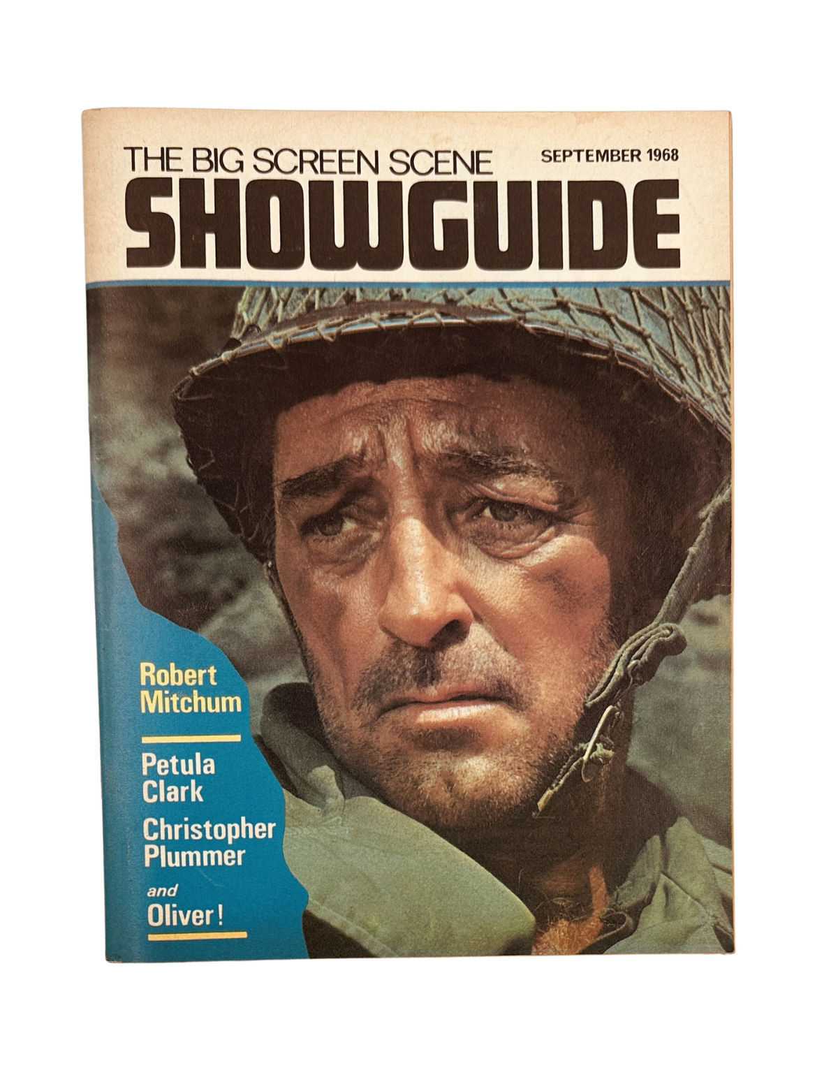 Cover of Showguide Magazine from September 1968 featuring Robert Mitchum, Petula Clark, Christopher Plummer, and highlights from the film Oliver! This vintage magazine showcases iconic moments from late-1960s cinema.