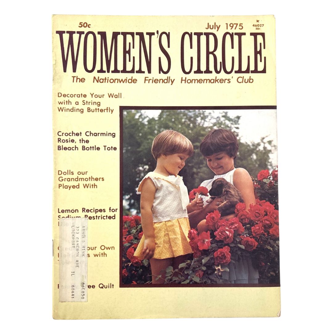 Cover of the VTG Women's Circle Magazine, July 1975 featuring the title 'Women's Circle' at the top, and images of two young girls interacting with flowers, one holding a puppy, embodying themes of friendship and homemaking.