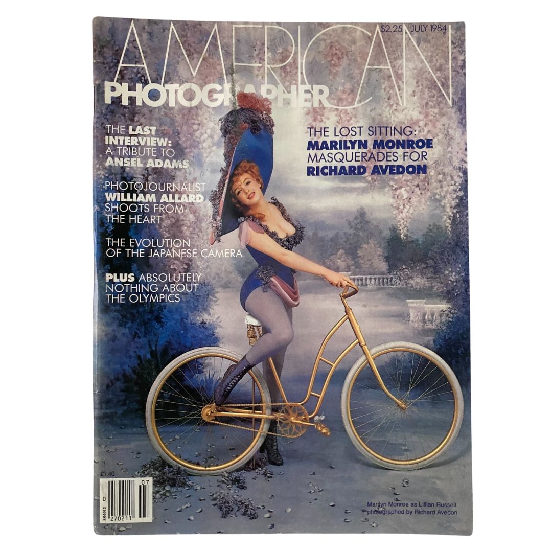American Photographer Magazine July 1984 featuring Marilyn Monroe on the cover, illustrated with a vintage design and a woman on a golden bicycle.