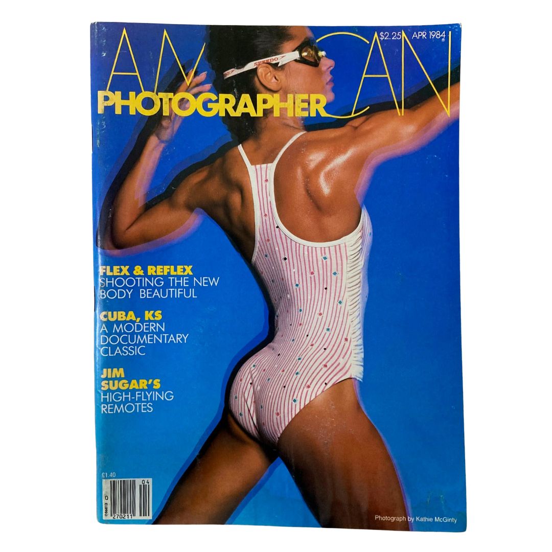 Cover of American Photographer Magazine April 1984 featuring bodybuilder Gladys Portugues in a swimming suit, highlighting fitness and bodybuilding culture of the era.