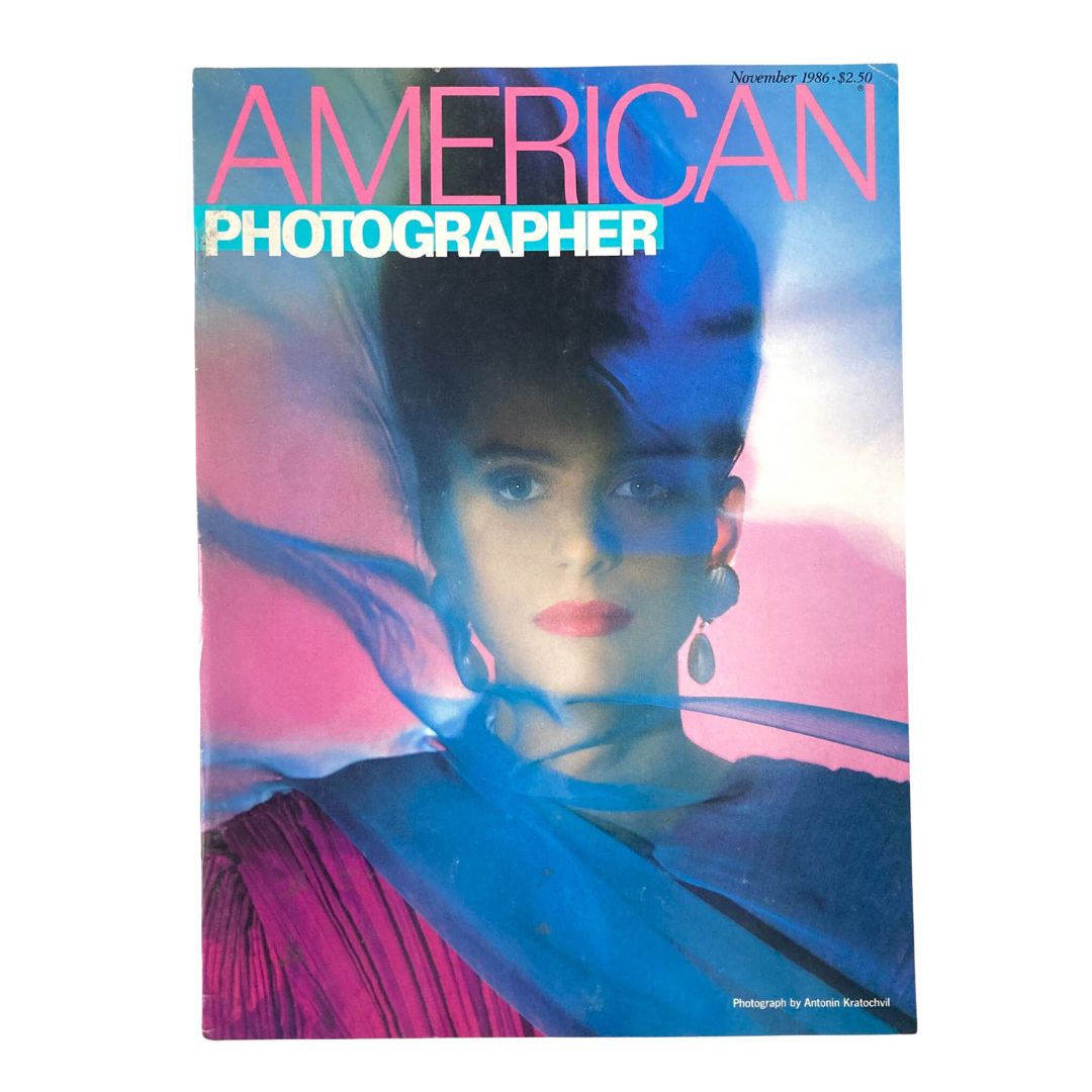 Cover of American Photographer Magazine November 1986 featuring model Anna Juvander, showcasing vibrant colors and high fashion photography.