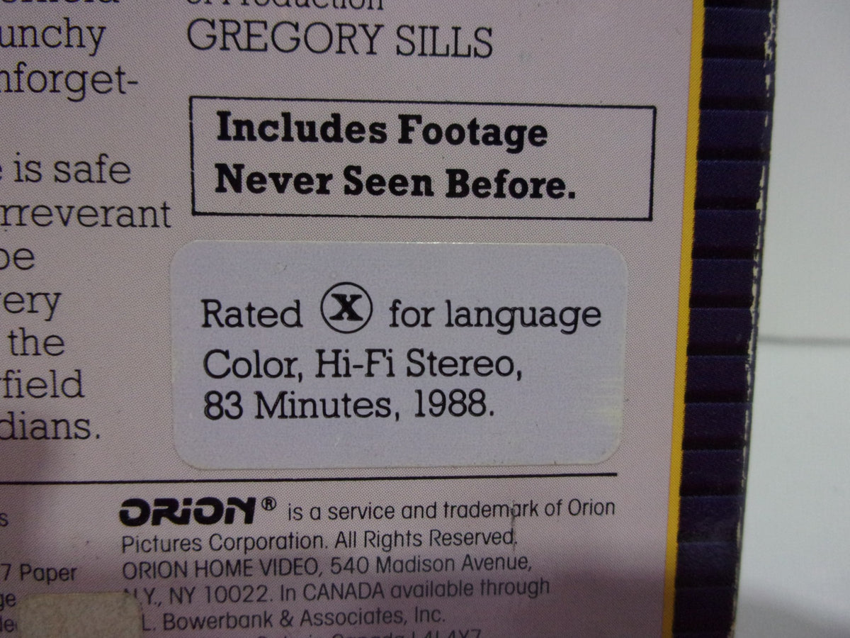 Label on the back of Nothin' Goes Right Rodney Dangerfield VHS indicating features and rating for language.
