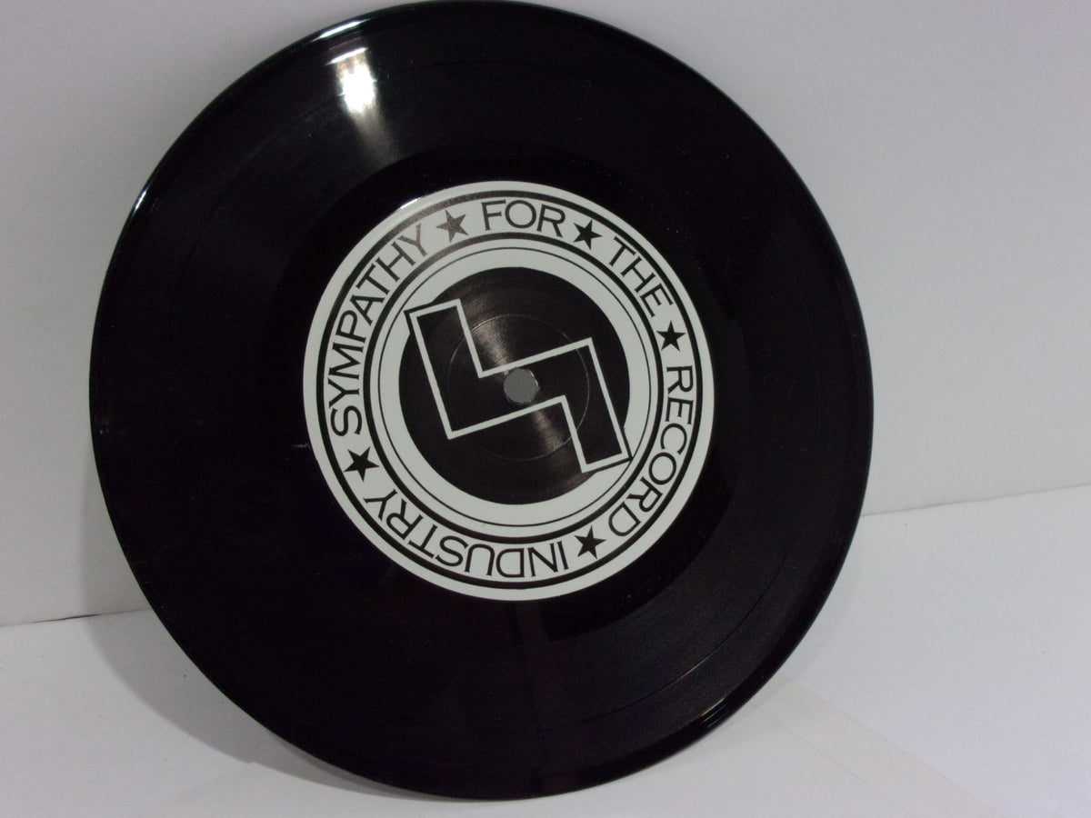 Skullflower: Evel Knievel SFTRI 202 7" Single vinyl record displaying the label 'Sympathy for the Record Industry' on a glossy black surface.