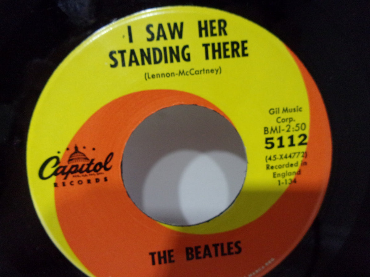 The Beatles: I Want To Hold Your Hand Capitol Records 5112 45RPM single label showing the song title 'I Saw Her Standing There' and original recording details.