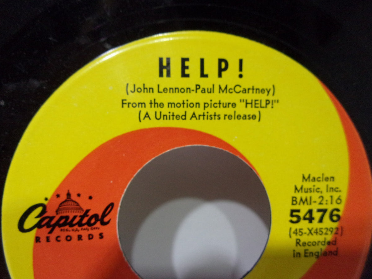 Detailed view of the label on The Beatles: Help! / I’m Down Capitol Records 5476, featuring song credits and record information.