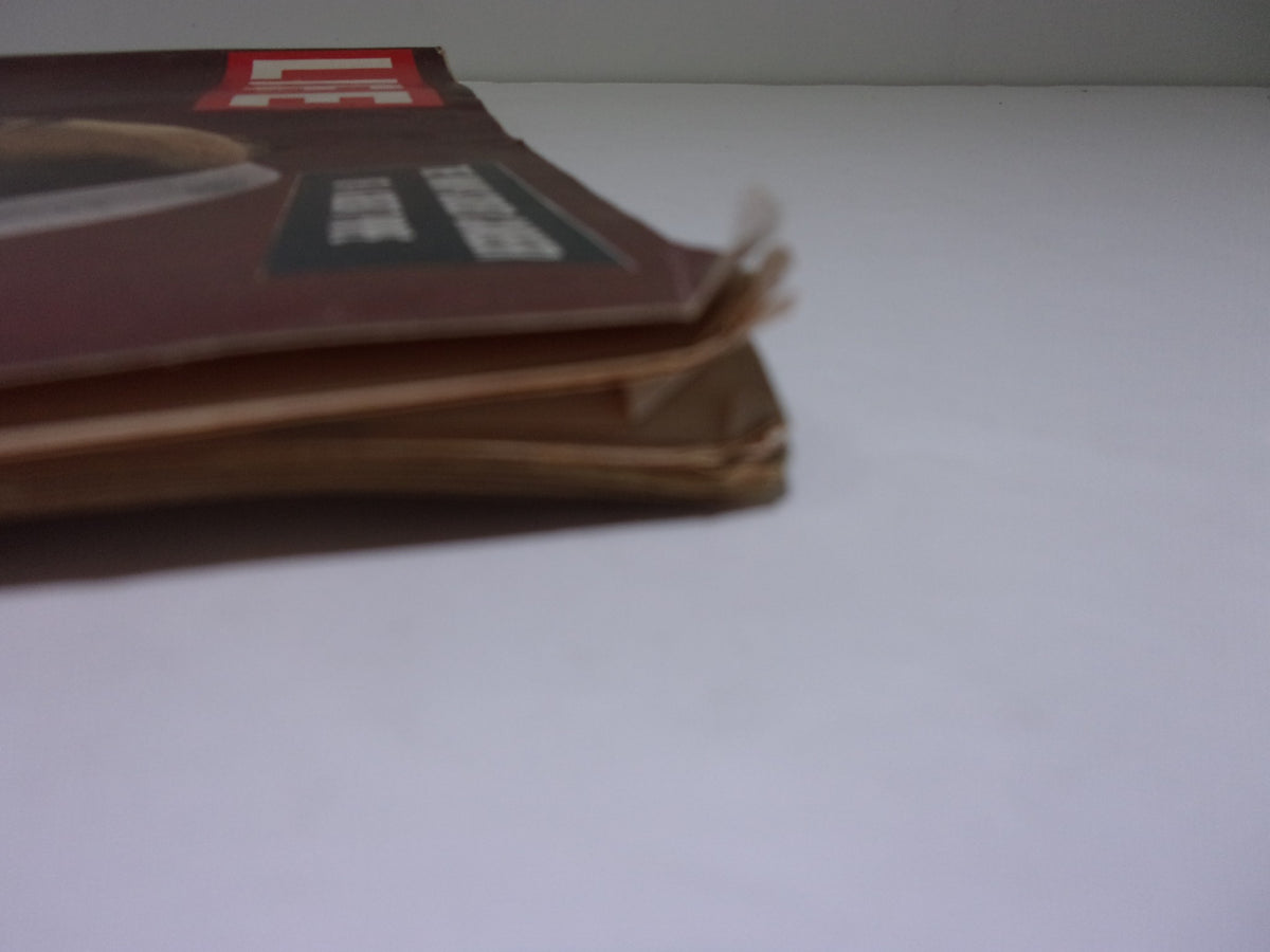 Side view of Life Magazine: December 13 1954, displaying the spine and edge condition, indicative of vintage magazine wear.