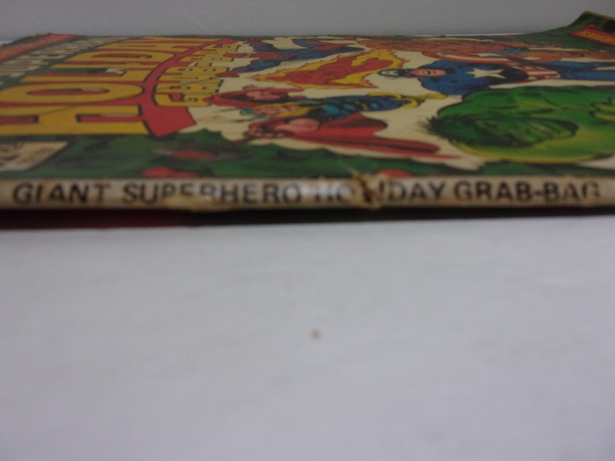 Another side view of the 1974 Marvel Treasury Special Giant Superhero Holiday Grab-Bag, illustrating the worn edges and the prominent title 'Giant Superhero Holiday Grab-Bag'.