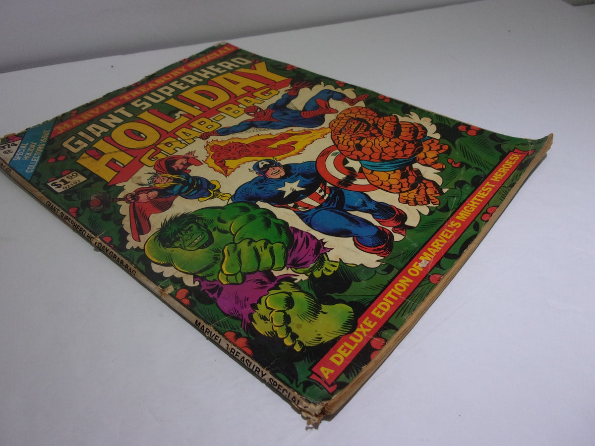 Side view of the 1974 Marvel Treasury Special Giant Superhero Holiday Grab-Bag, displaying vibrant cover artwork of Marvel superheroes surrounded by festive elements, emphasizing its collectible nature.