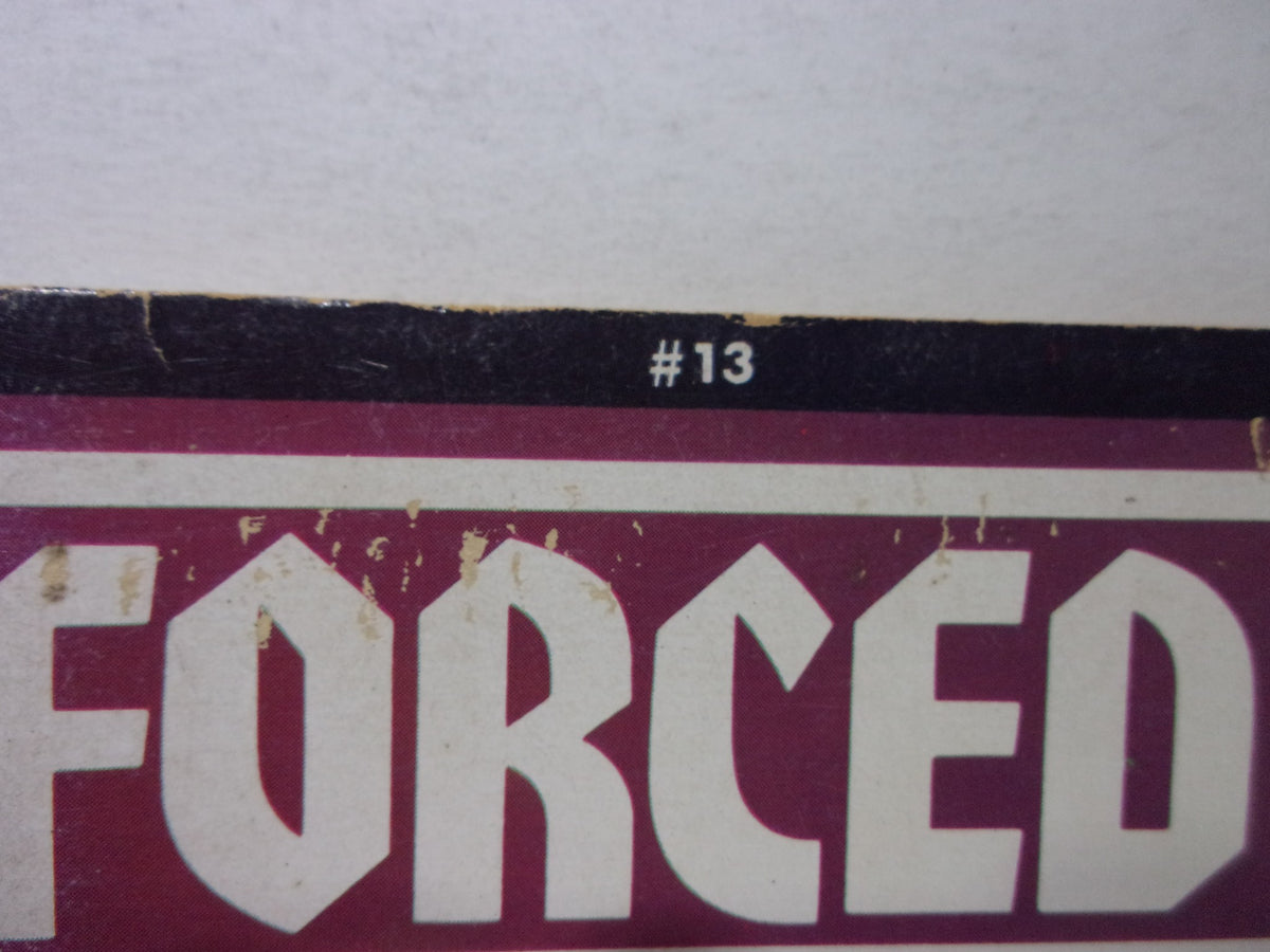 Close-up of the top portion of Forced Exposure Magazine: Chain Gang, Winter 1988 #13, highlighting the '#13' issue number with slight damage.