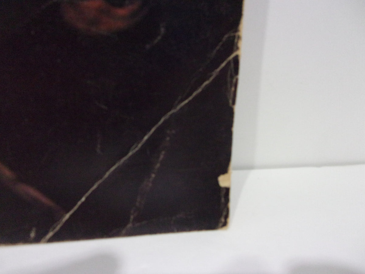 Close-up view of the cover of Forced Exposure Magazine #15 featuring artistic damage and wear, representing Summer 1989 edition with a focus on underground music.