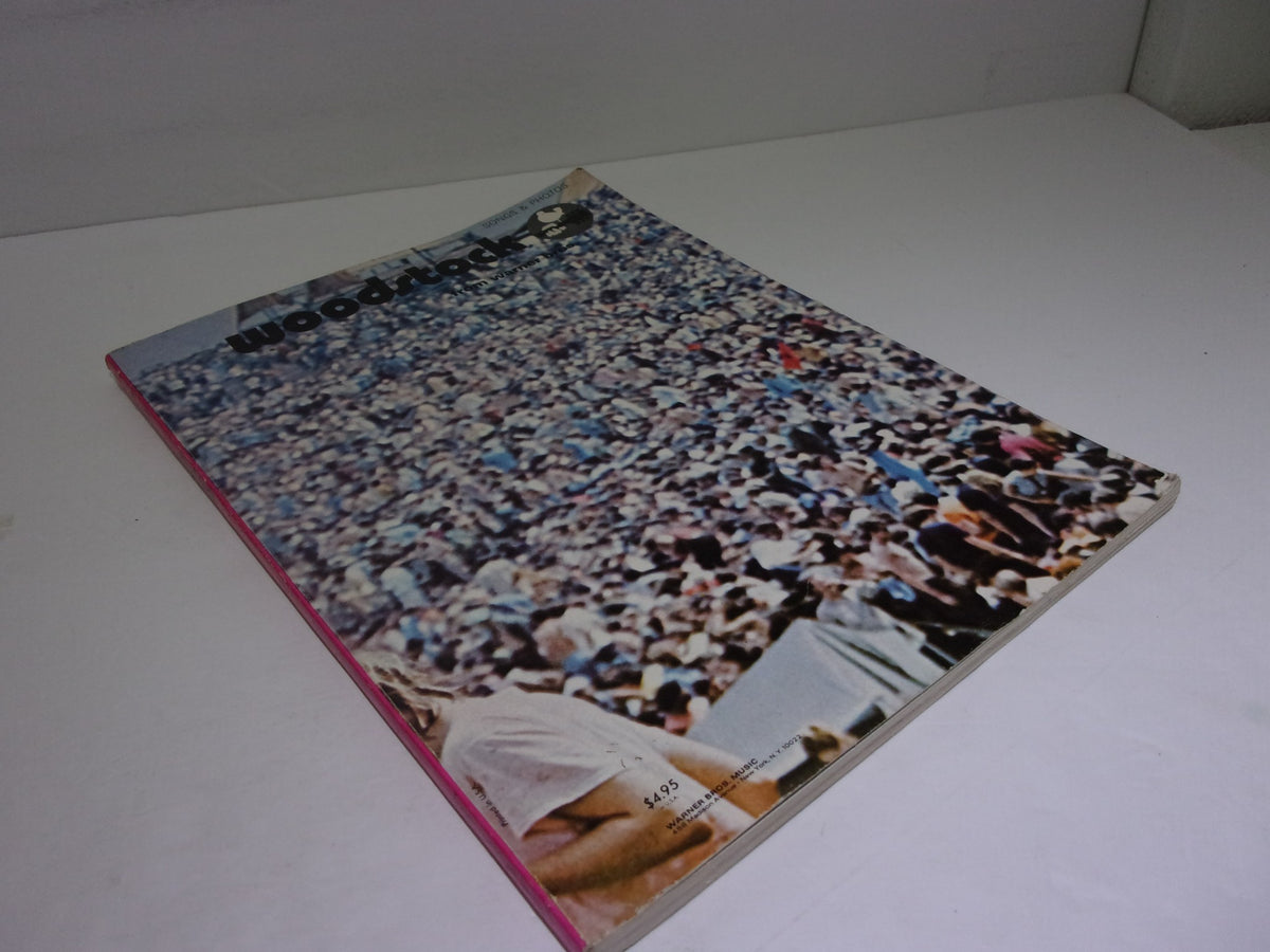 Vintage Woodstock Song Book cover featuring a large crowd of festival attendees. This collectible magazine, associated with director Michael Wadleigh, captures the essence of the historic Woodstock music festival, ideal for music lovers and collectors.
