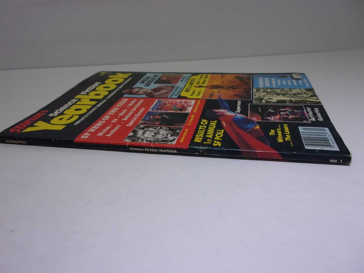 Side view of the cover of Starlogs Science Fiction Yearbook Vol. 1 displaying colorful graphics and text related to science fiction art.