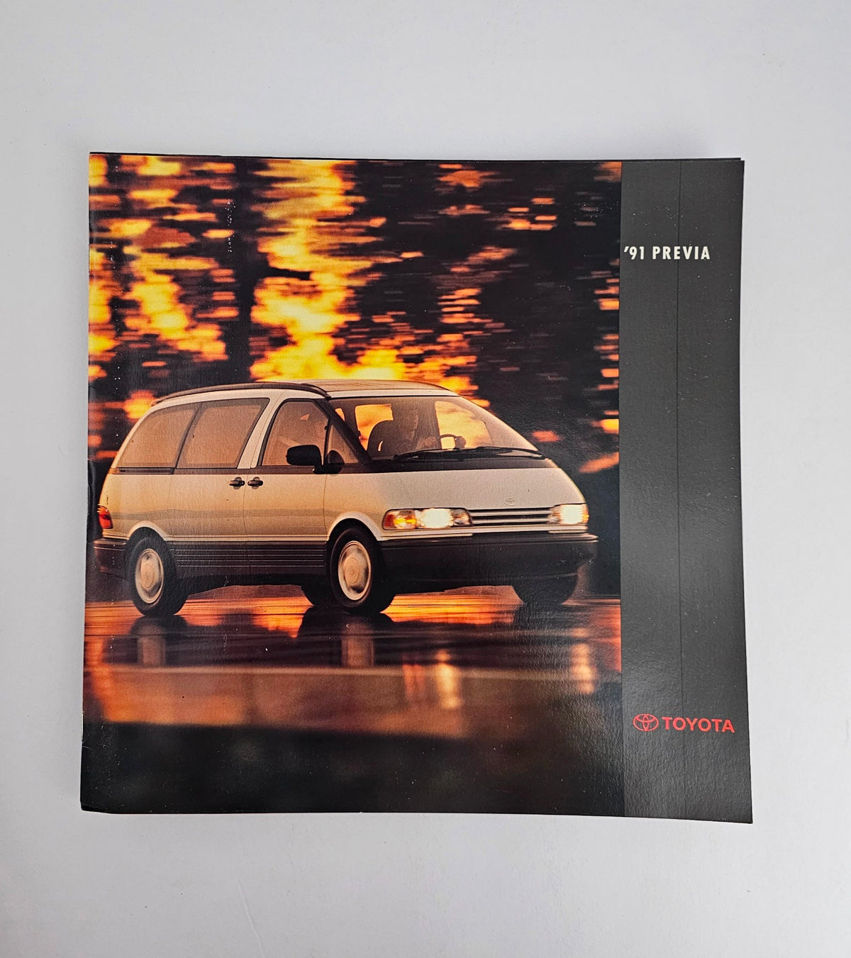 1991 Toyota Previa 2.4L 2AZ-FE Dealer Showroom Sales Brochure showcasing the vehicle in a dynamic driving scene.