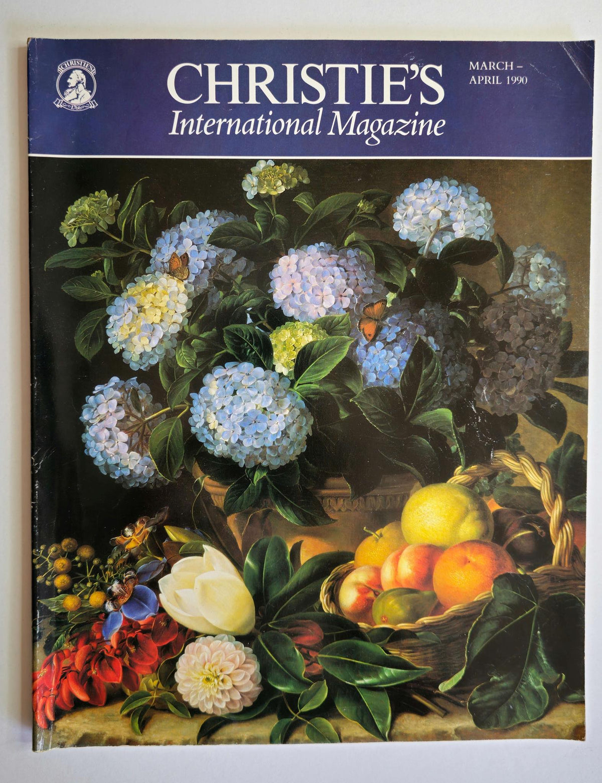 Cover of Christie's International Magazine, March - April 1990, featuring a vibrant still life painting with flowers and fruits, reflecting the essence of vintage art publications.