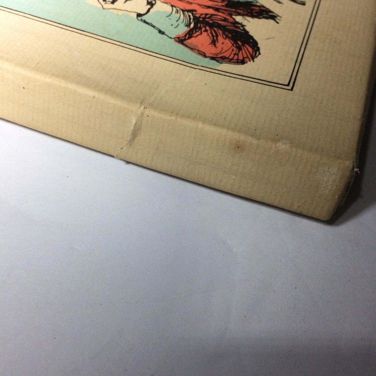 Side view of the Vintage 1976 Williamsburg Calendar & Almanack, highlighting some creases and minor wear on the cover.