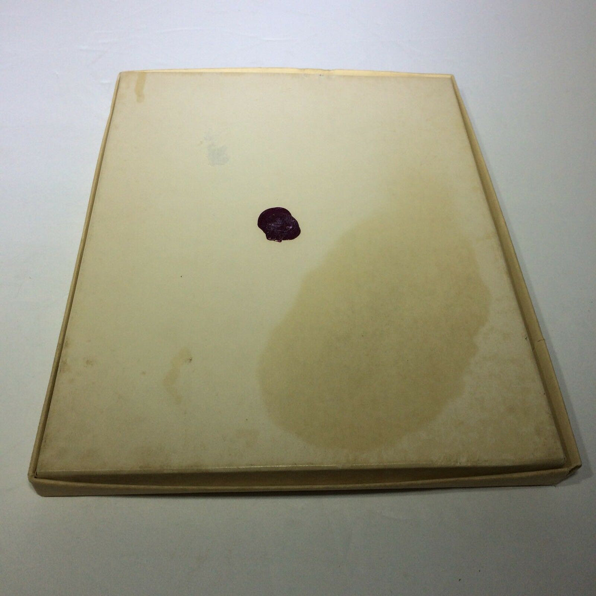 Back view of the Vintage 1976 Williamsburg Calendar & Almanack, showing some stains and discoloration, illustrating the vintage item's condition.