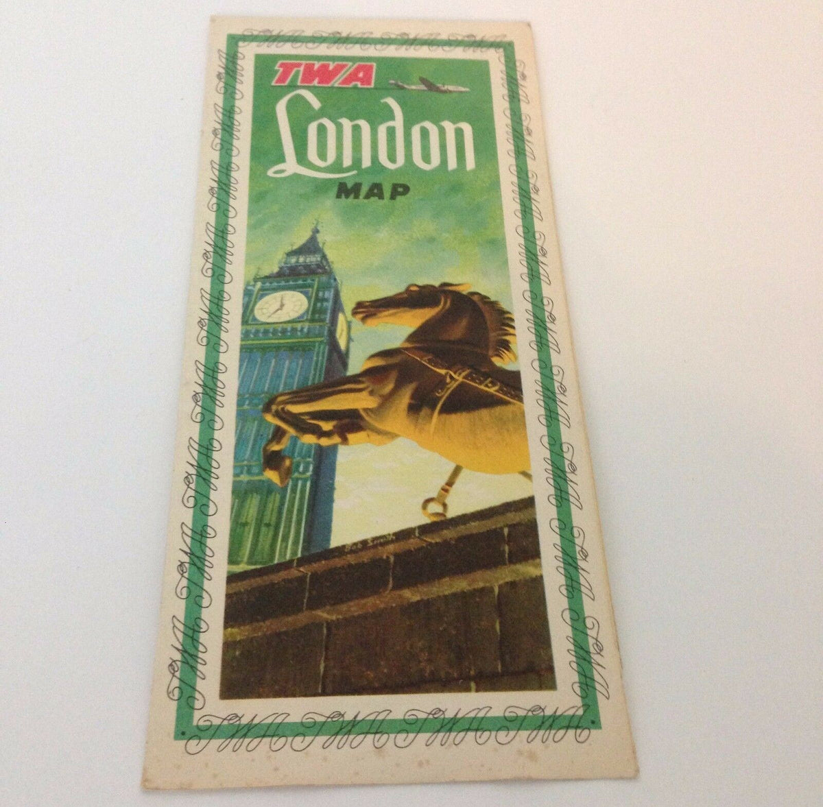Cover of the Vintage 1953 TWA Trans World Airlines illustrated city map of London, England, showcasing iconic landmarks like Big Ben and a beautiful horse statue.