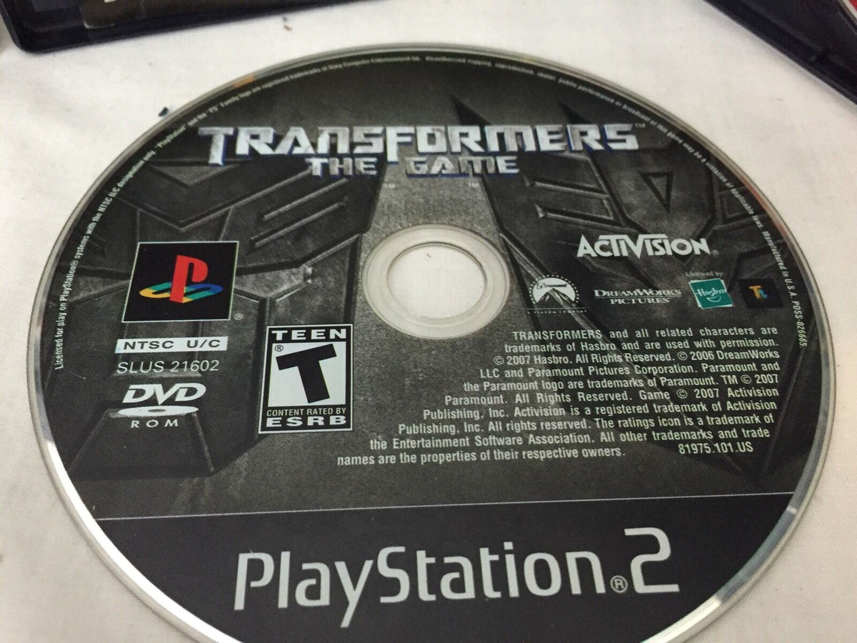 Image of Transformers video game disc for PlayStation 2, showcasing the title within the collection 4 Devil May Cry 3 Dante's Awaken Transformers Shadow Hedgehog Lego star wars Ps2.