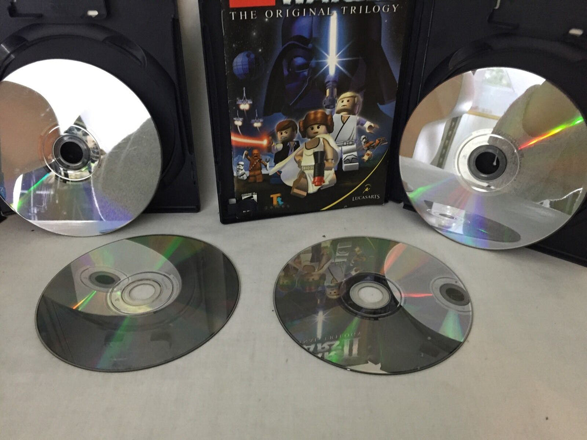 LEGO Star Wars: The Original Trilogy game discs featured within a vintage gaming magazine, part of the 4 Devil May Cry 3 Dante's Awaken Transformers collection.