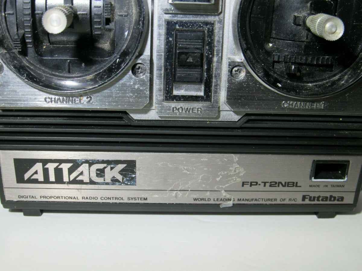 Close-up of Futaba Attack-R FP-T2NBR Remote Control RC Controller's control panel detailing the channels and power options.