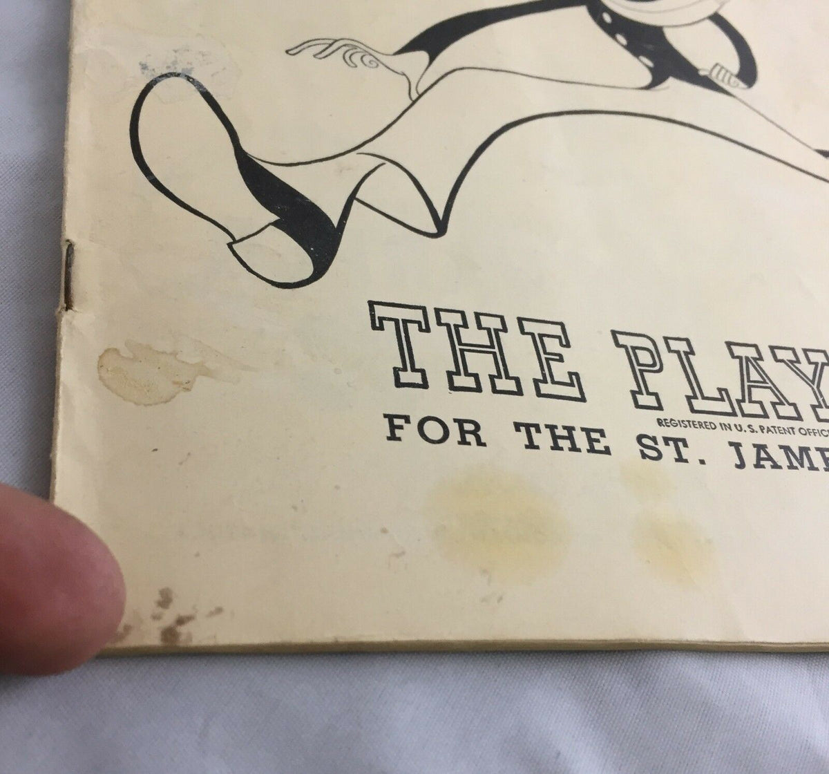 Close-up view of Vintage June 1949 Broadway Theatre Playbill 'Where's Charley?' showing edge wear and stains, highlighting its authentic vintage condition.