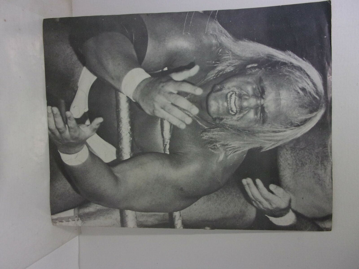 Action shot from the Special Tribute Hulk Hogan Magazine: Hulk - A - Mania Running Wild!, depicting Hulk Hogan in a wrestling ring, showcasing his muscular physique and expressive performance.