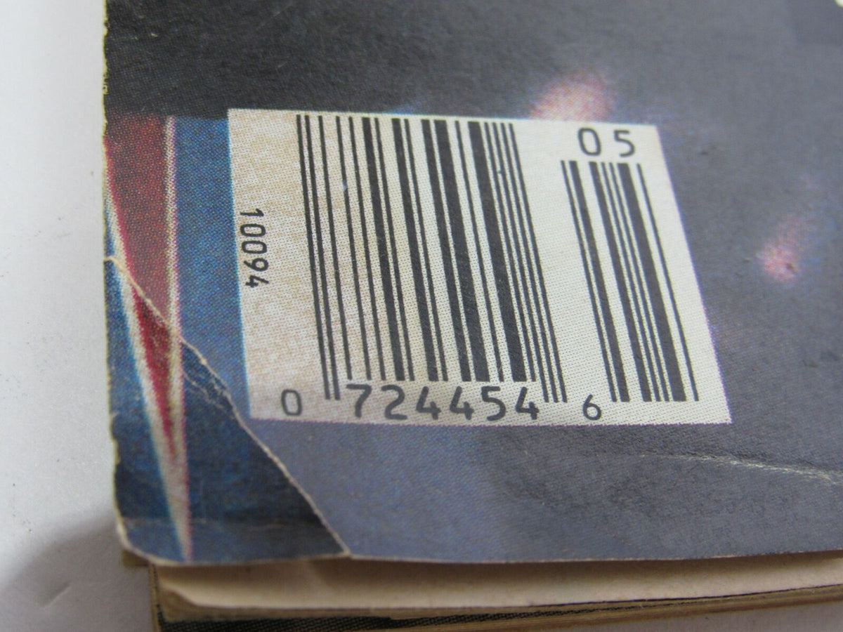 Detailed view of the barcode on the back cover of Sports Illustrated February 1, 1988, which features the iconic 'TOO MUCH! Mike Tyson KO's Larry Holmes' edition.