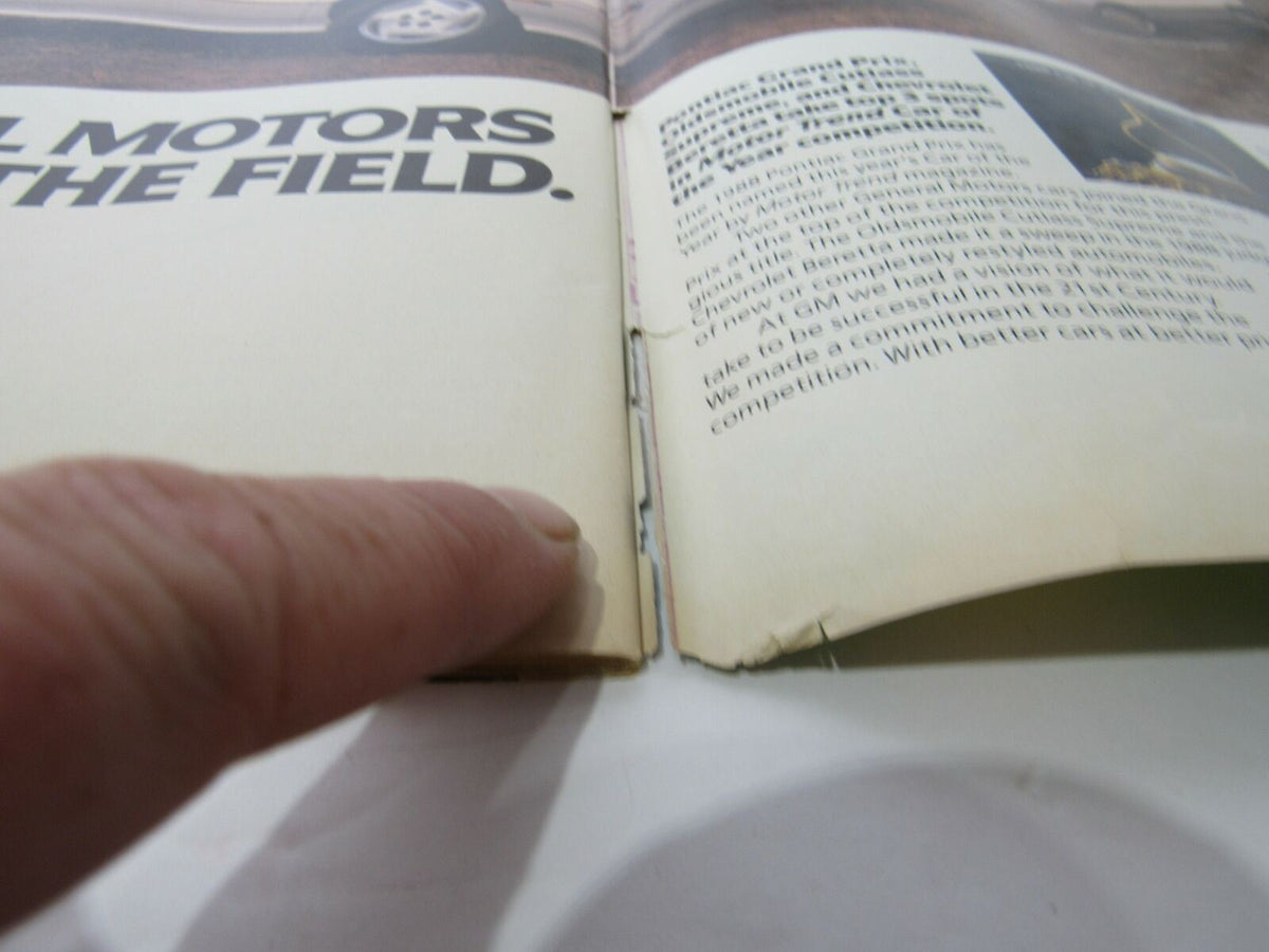Inside view of Sports Illustrated February 1 1988, showing a finger pointing at the edge of the magazine, highlighting some wear on the binding.
