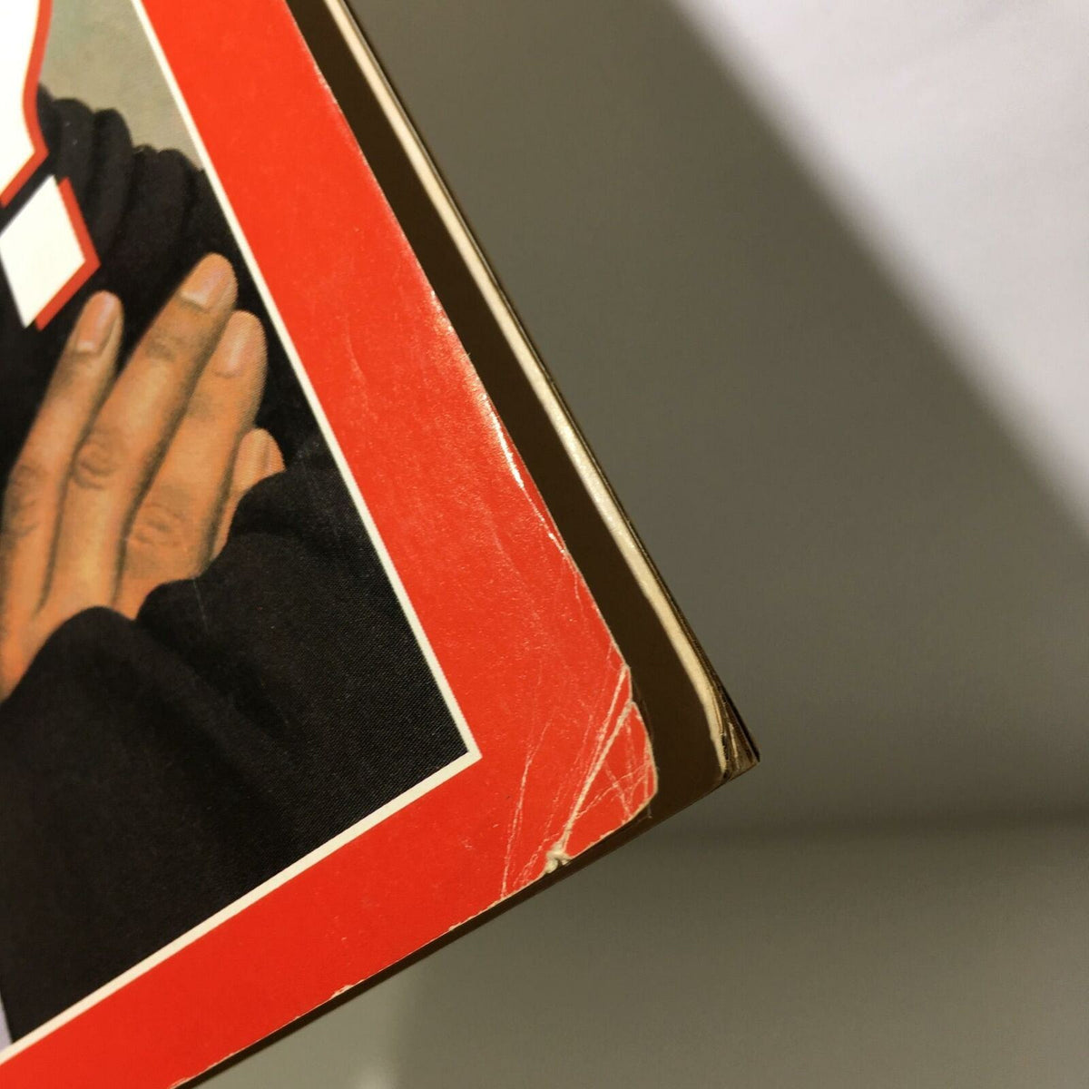 Edge detail of the Time Magazine cover from April 11, 1988, illustrating minor wear and age, emphasizing its collectible nature.