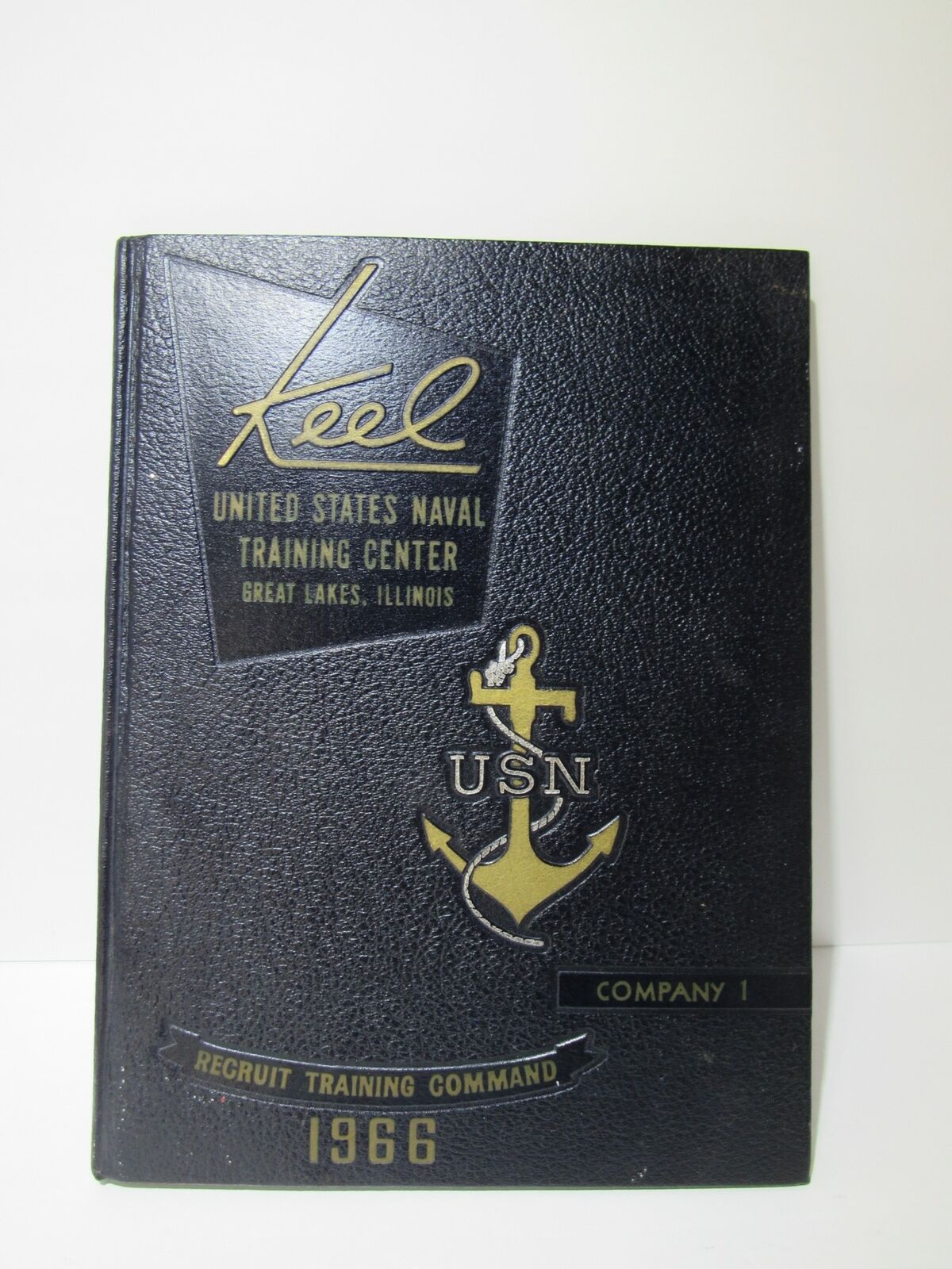 Cover of the Vintage 1966 Keel United States Naval Training Center Company 1 yearbook featuring a nautical design with an anchor and the text detailing the training center.