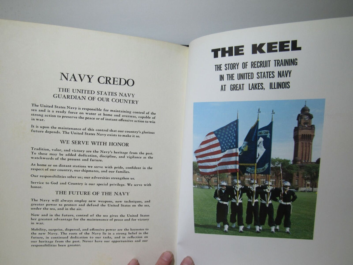Interior page of the Vintage 1966 Keel United States Naval Training Center Company 1 yearbook featuring the Navy Credo alongside a photo of flag bearers in front of the training center, illustrating the commitment to service.