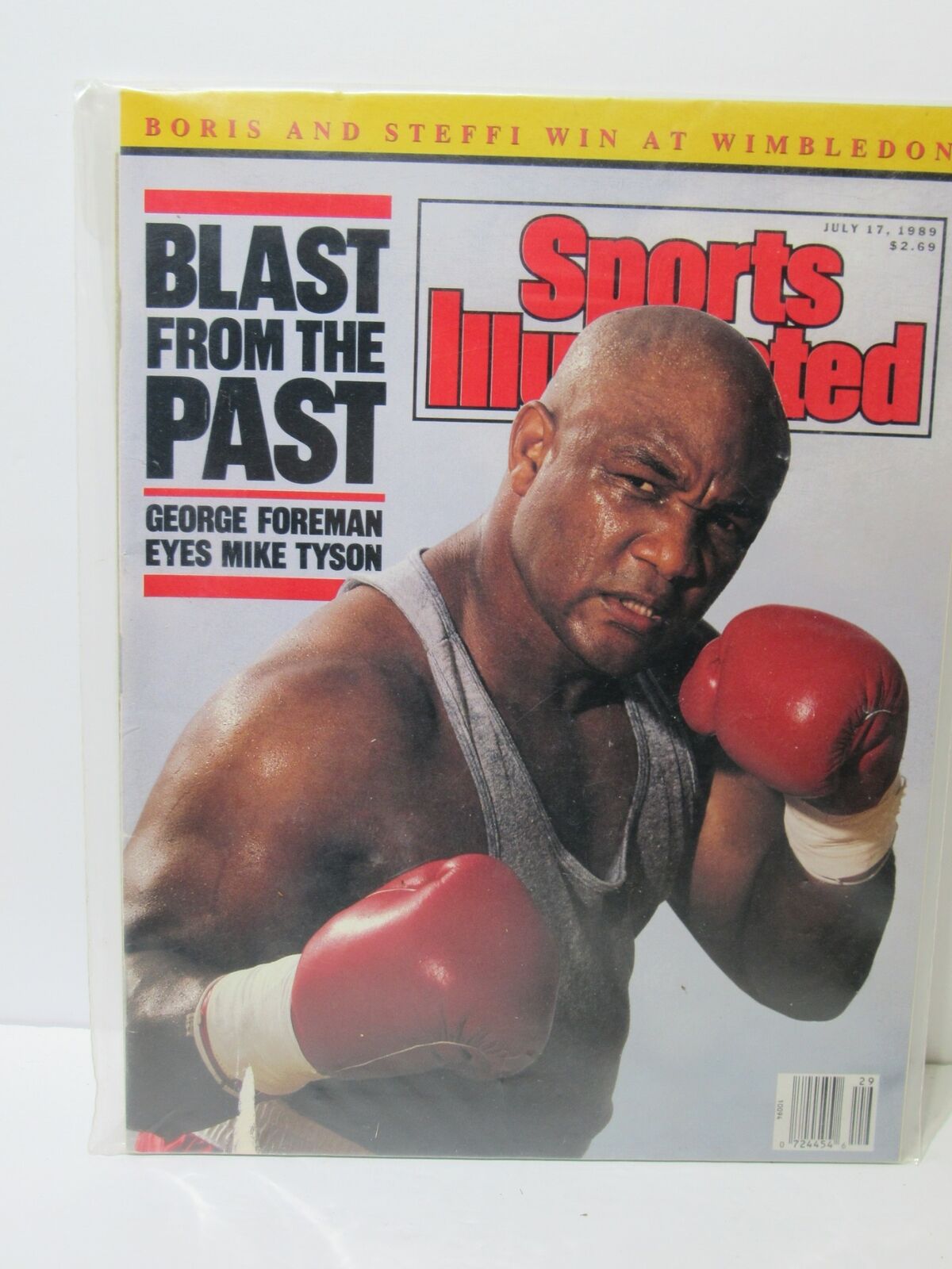 Cover of Sports Illustrated June 17, 1989 edition featuring the title 'Blast From The Past: George Foreman Eyes Mike Tyson' and an image of George Foreman in boxing gloves.