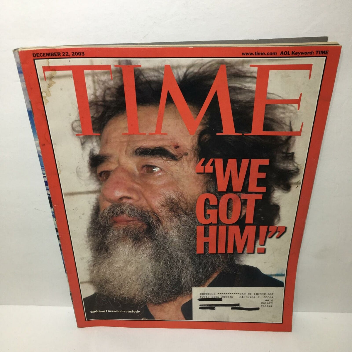 Time Magazine December 22, 2003 cover featuring the headline 'We Got Him!' alongside an image of Saddam Hussein in custody. A significant collectible for history buffs and a reflection of contemporary events.