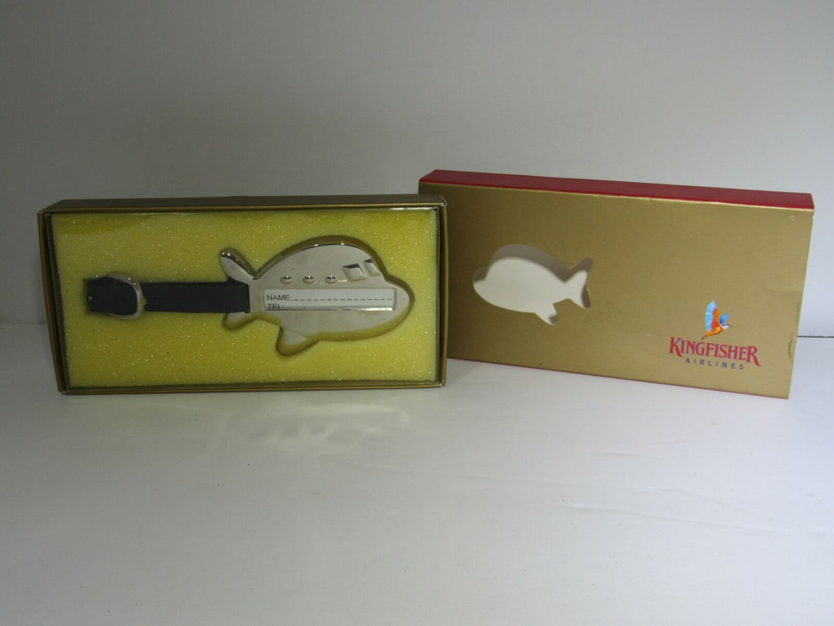Rare Kingfisher Airlines Luggage Tag First Class Metal Airplane displayed in its original box, featuring a shiny chrome design and a luxurious presentation.