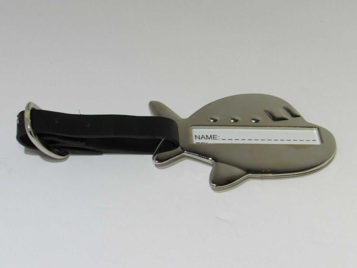 Rare Kingfisher Airlines Luggage Tag First Class Metal Airplane, designed in a shiny chrome airplane shape with a space for personal identification.