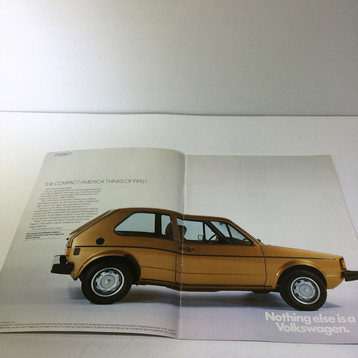 1982 Island Volkswagen Rabbit Fuel-Injected Engine 74 Horsepower Car Brochure showcasing a side view of a golden Volkswagen Rabbit.