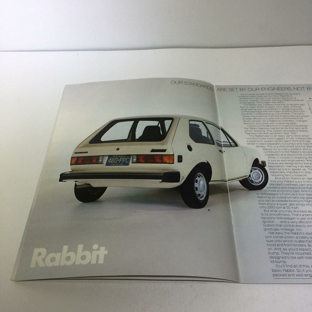 1982 Island Volkswagen Rabbit Fuel-Injected Engine 74 Horsepower Car Brochure displaying a rear view of a white Volkswagen Rabbit.