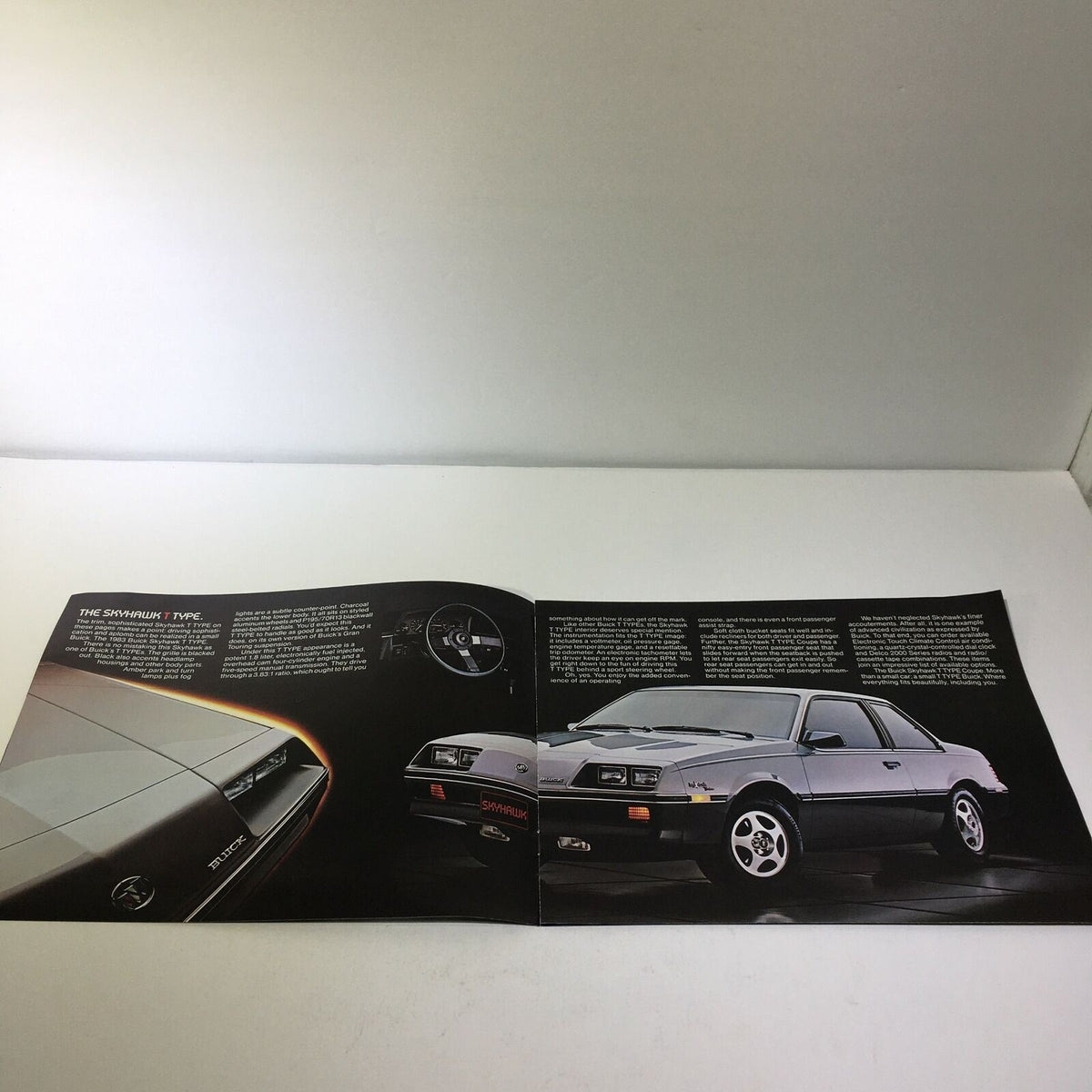 1983 The Buick T Type Skyhawk 1.8 Liter Fuel-Injected V-6 Engine Car Brochure displaying the sporty features of the Buick Skyhawk model, including interior and design details.
