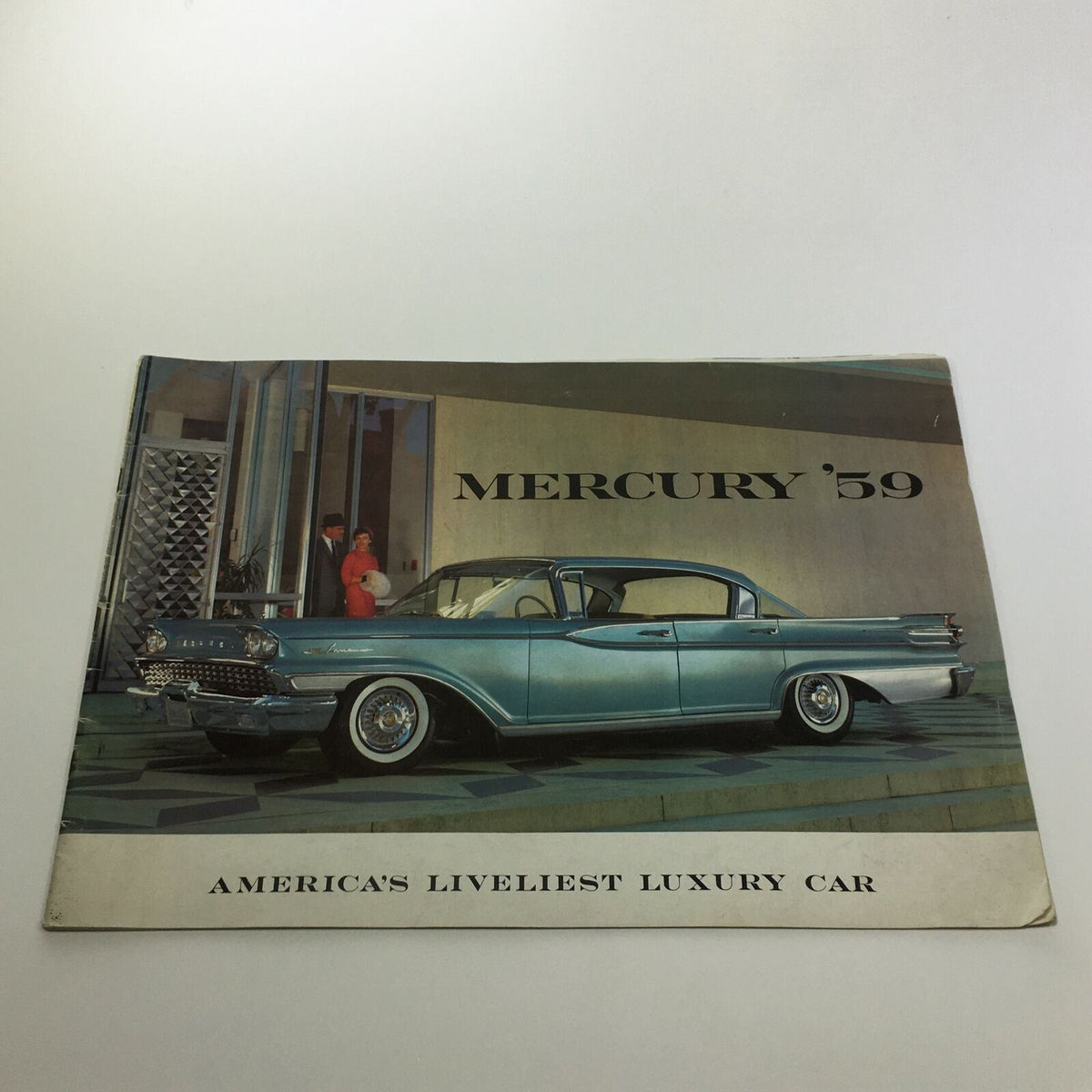 1959 Mercury America's Liveliest Luxury Car Monterey 2-Door Sedan Brochure cover featuring the car parked outside a modern building.