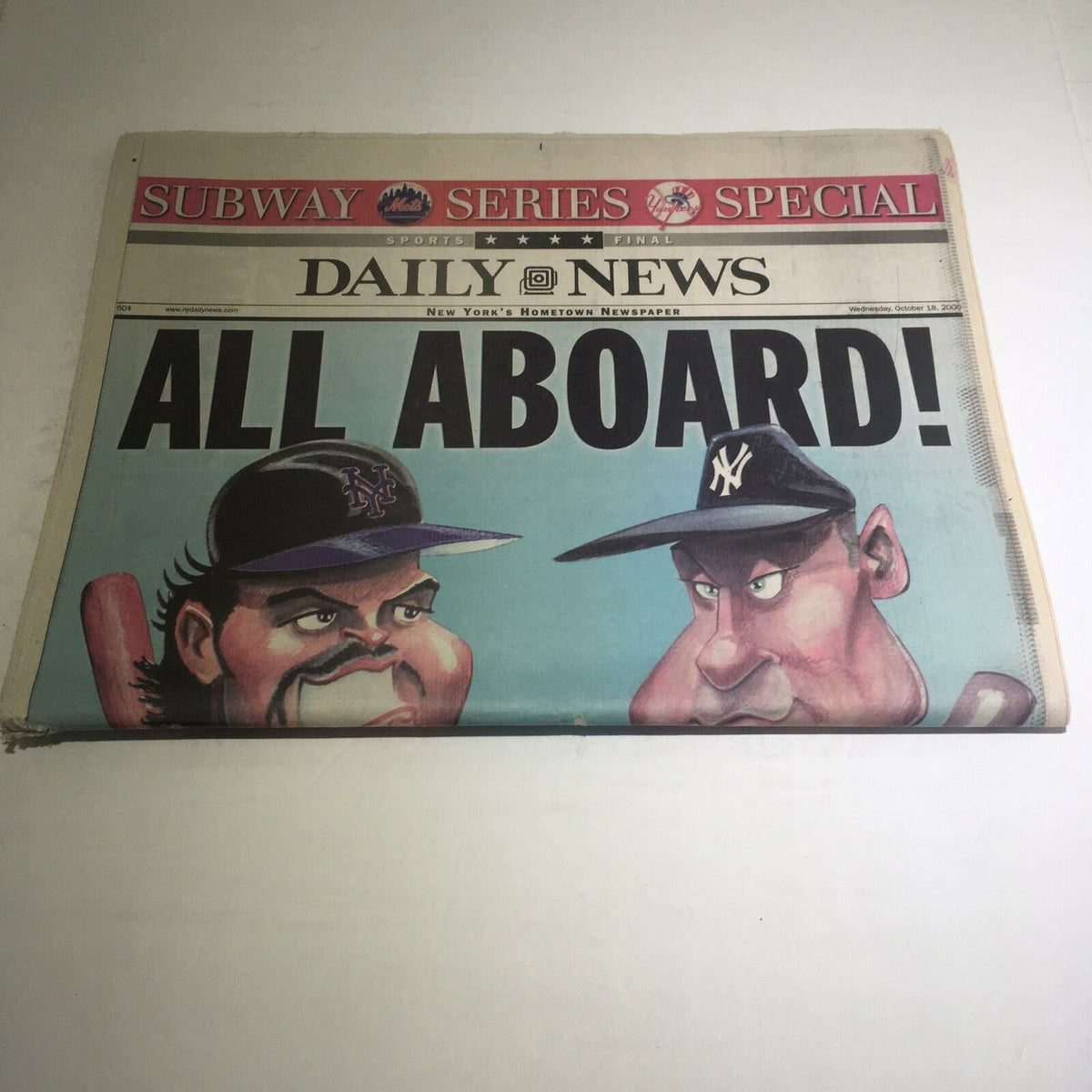 Front page of the NY Daily News: Oct 18 2000 All Aboard! showcasing characters with baseball caps and an expressive illustration.