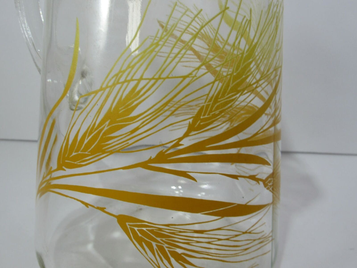 Detailed view of the golden wheat design on the Vintage Libbey Glass Pitcher with Ice Lip, emphasizing its rustic charm and vintage appeal.