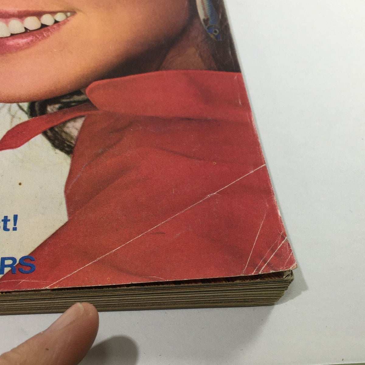 Detailed view of the bottom corner from VTG Mademoiselle Magazine: September 1981, highlighting the wear and tear including bent edges and creases.