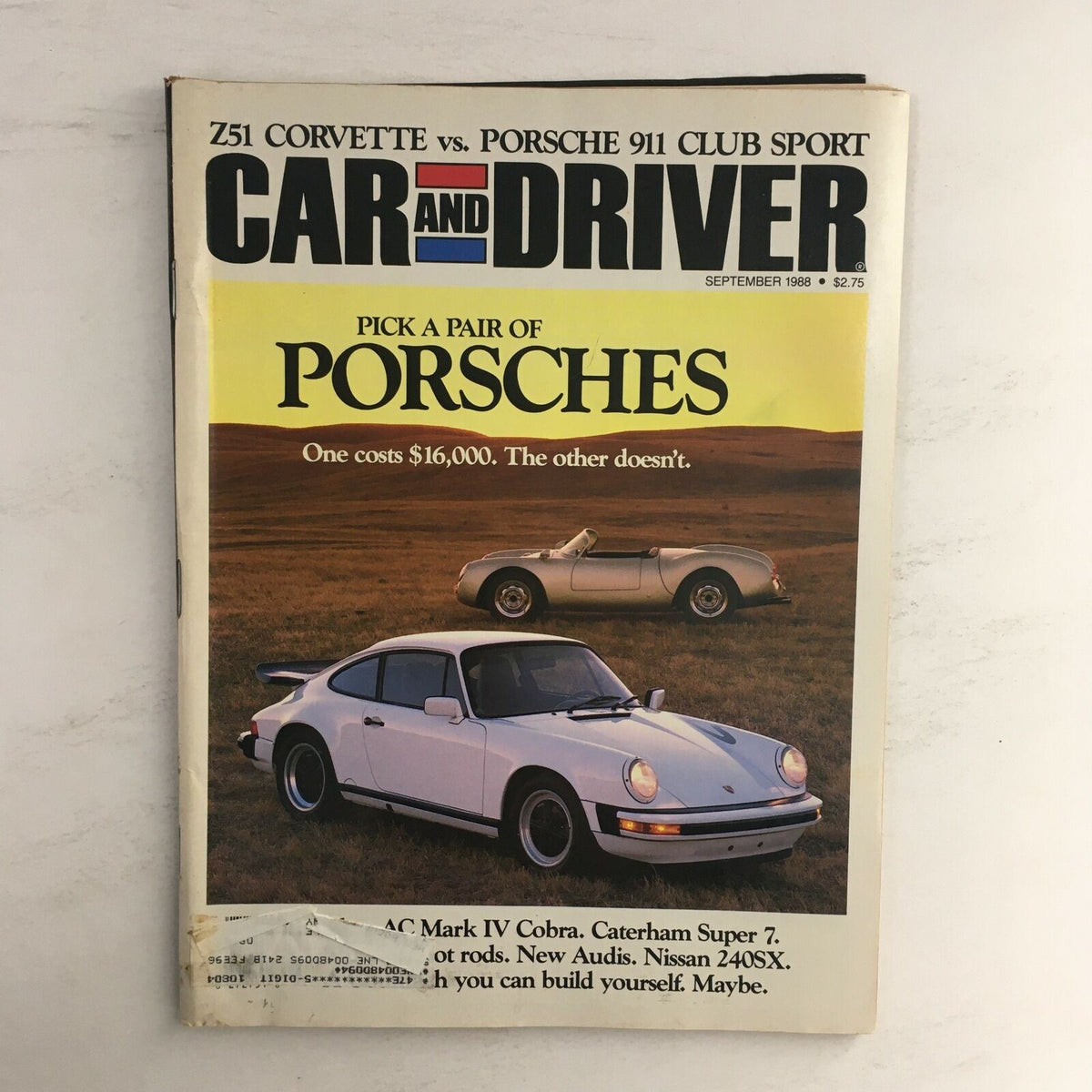 Cover of Car and Driver Magazine, September 1988, featuring a comparison of the Z51 Corvette vs Porsche 911 Club Sport, with images of the two cars showcased in a grassy field.