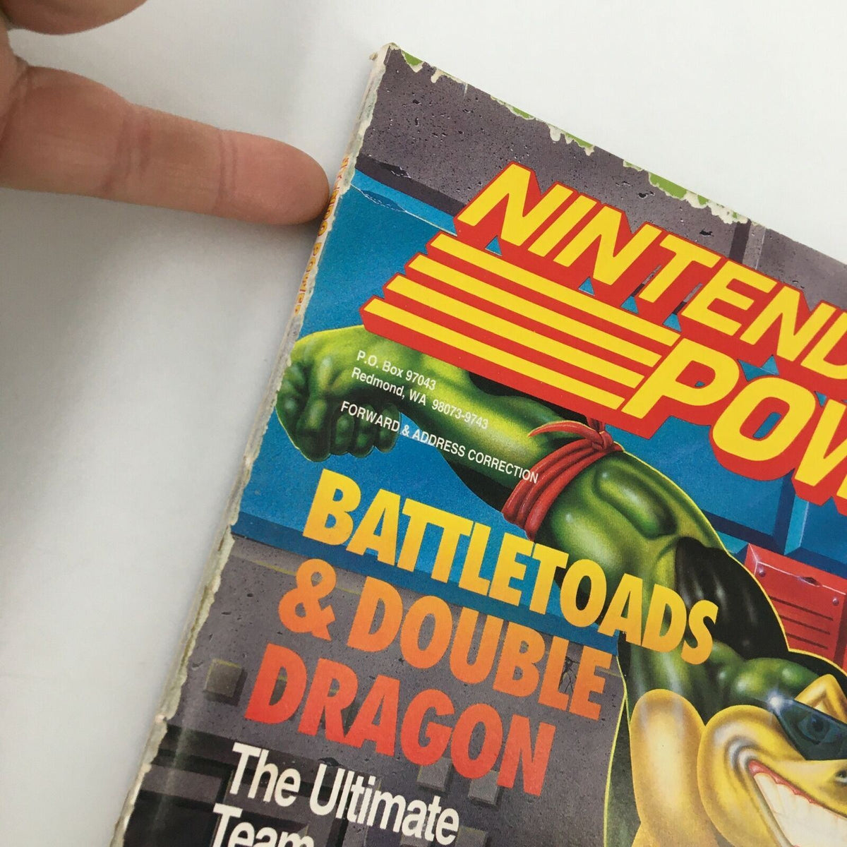 Side view of Nintendo Power Magazine June 1993 #49 highlighting the issue title 'Battletoads & Double Dragon' with visible wear on the magazine.